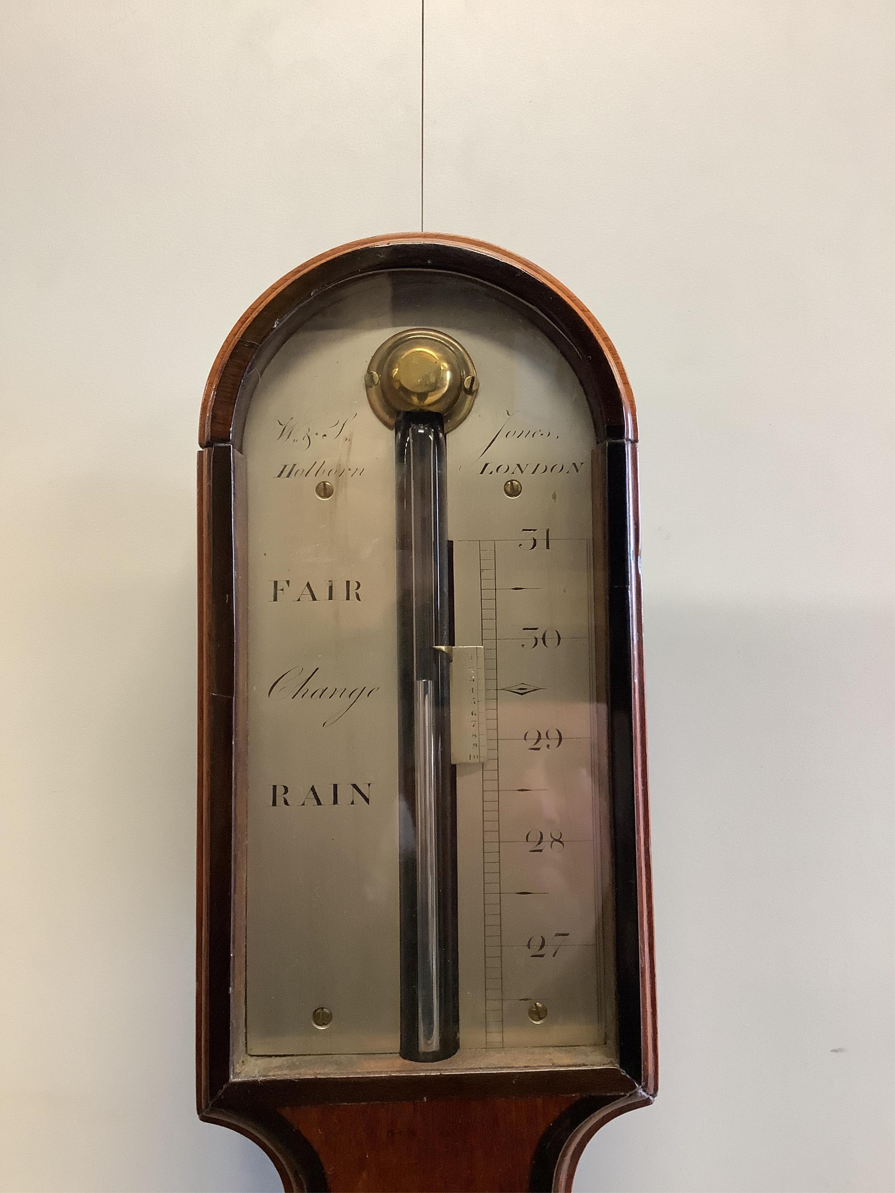 An early 19th century walnut stick barometer by Jones Holborn, height 95cm. Condition - good